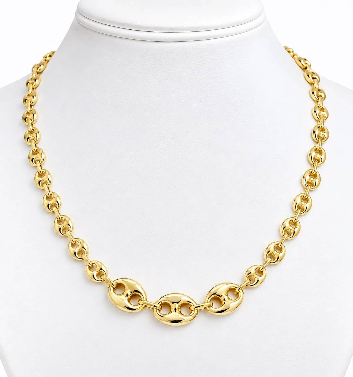 Graduated gold mariner link necklace on a white bust